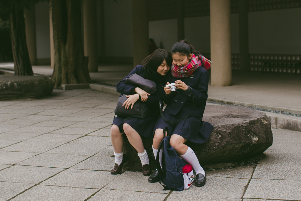 Japanese teenage students taking pictures - The cat, you and us