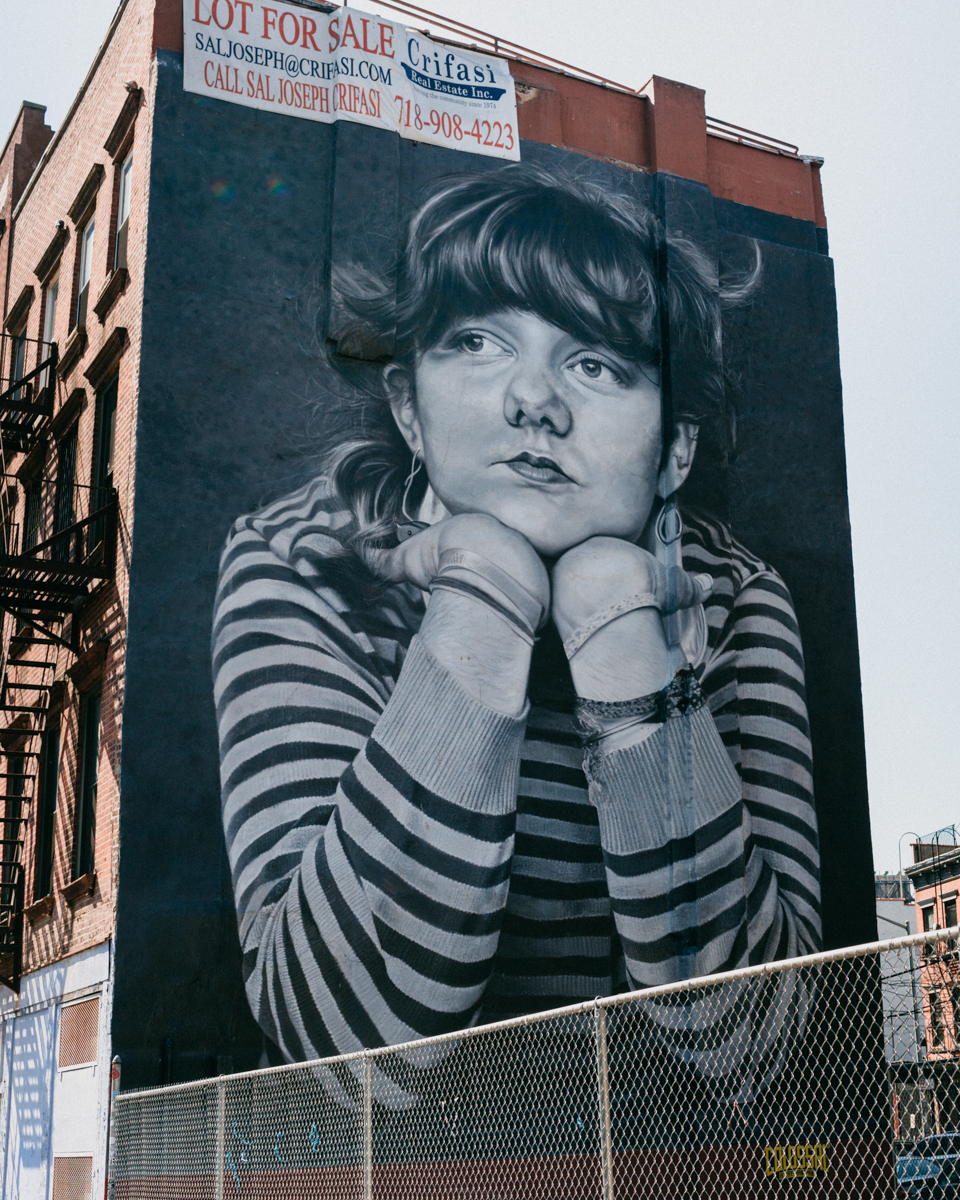 Girl with a striped sweater graffiti in Brooklyn - The cat, you and us
